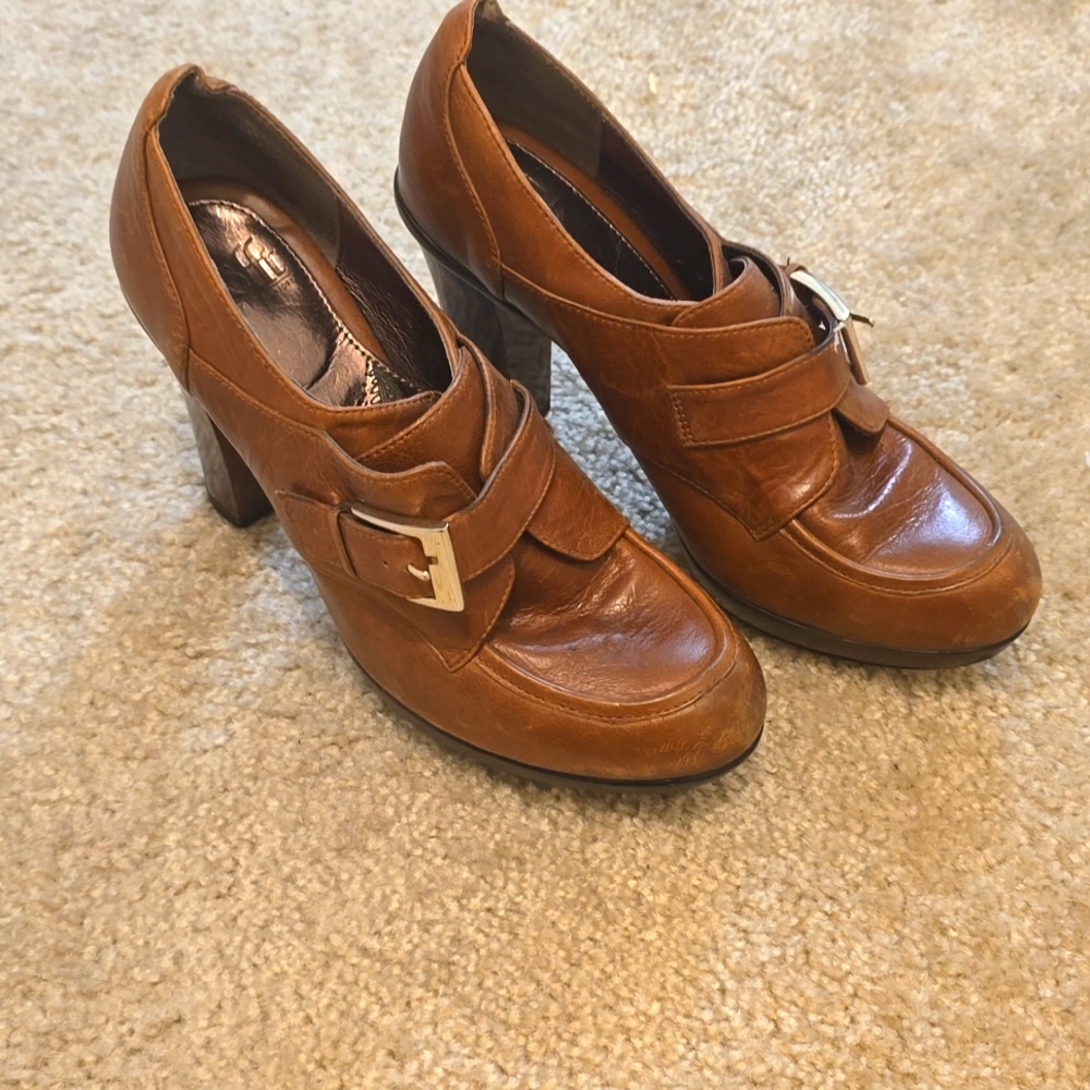 Brown leather mary janes with wood heels